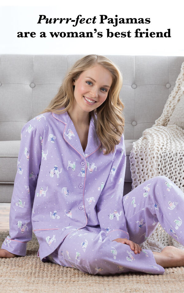 Model wearing Purrfect Flannel Boyfriend Pajamas - Purple in a bedroom with the following copy: Purrr-fect Pajamas are a women's best friend