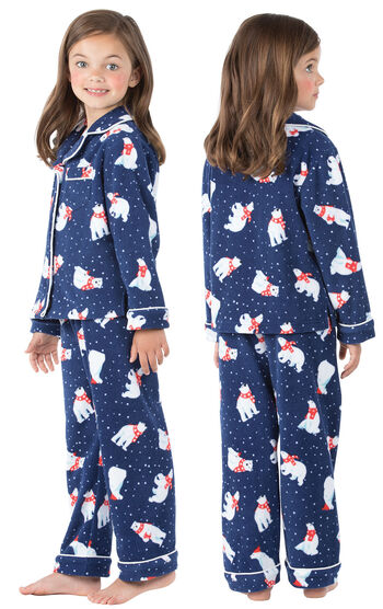 Model wearing Navy Polar Bear Fleece Button-Front PJ for Girls, facing away from the camera and then facing to the side