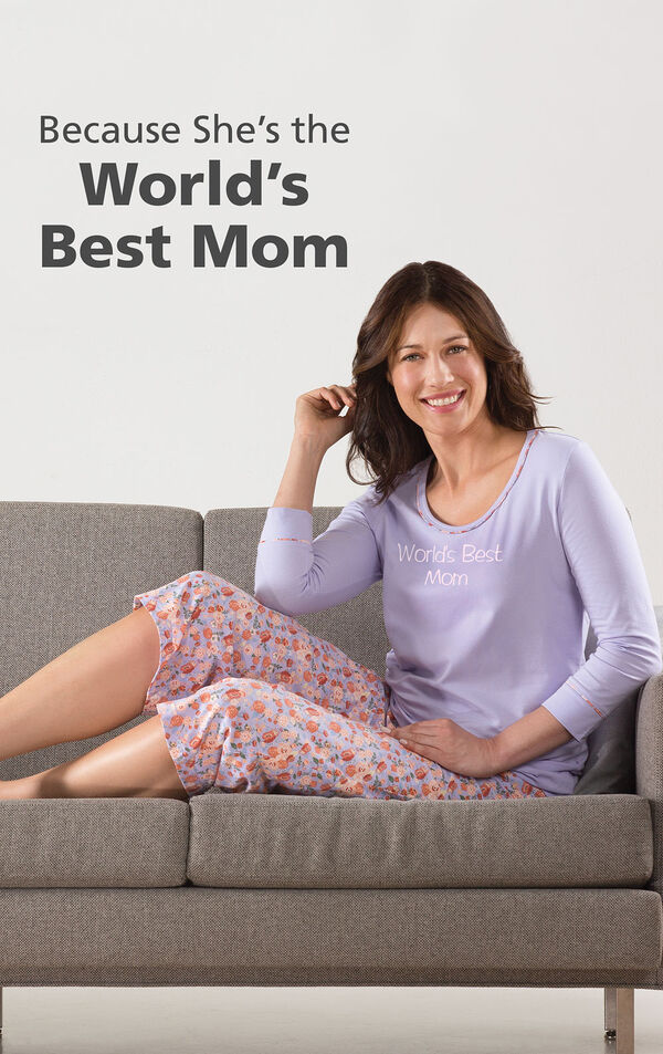 Model wearing World's Best Mom Pajamas sitting on couch with the following copy: Because she's the World's Best Mom image number 2