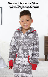 Boy wearing Nordic Fleece Hoodie-Footie by bed with the following copy: Sweet Dreams Start with PajamaGram. image number 1