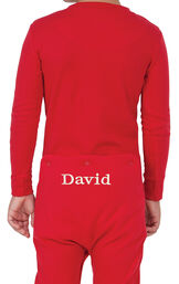 Model wearing Red Dropseat Onesie PJ for Youth, facing away from the camera image number 1