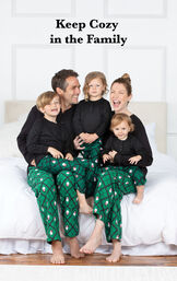Family sitting on bed wearing Snowman Argyle Matching Family Pajamas with the following copy: Keep Cozy in the Family image number 1
