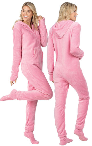 Model wearing Hoodie-Footie - Pink Fleece for Women, facing away from the camera and then to the side