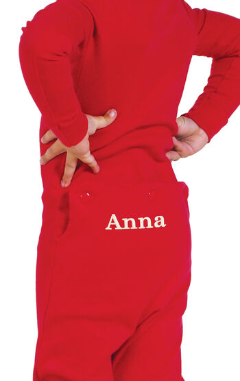 Model wearing Red Dropseat Onesie PJ for Infants, facing away from the camera