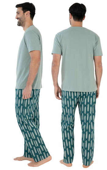 Model wearing Teal Surfboard Print Margaritaville PJ with Graphic Tee for Men, facing away from the camera and then to the side