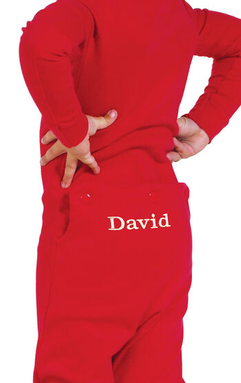 Model wearing Red Dropseat Onesie PJ for Toddlers, facing away from the camera