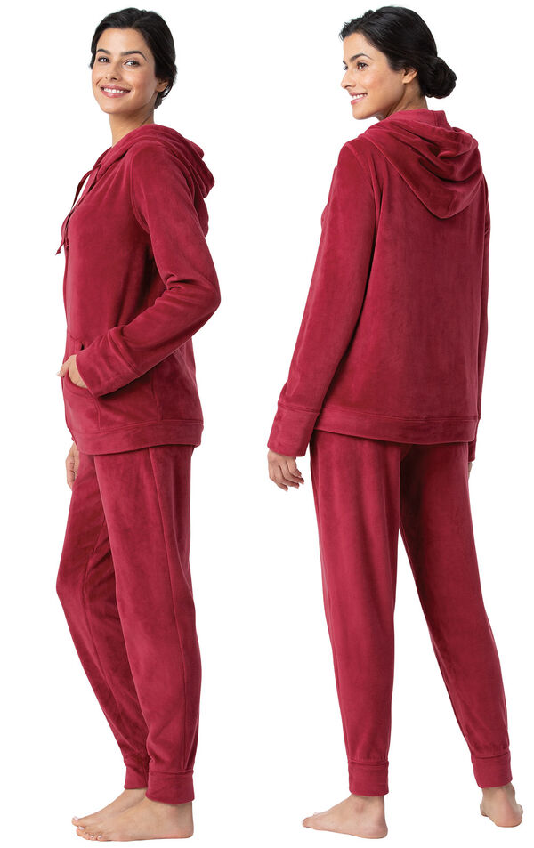 Model wearing Deep Red Zip Front Hoodie Pajamas, facing away from the camera and then facing to the side image number 1