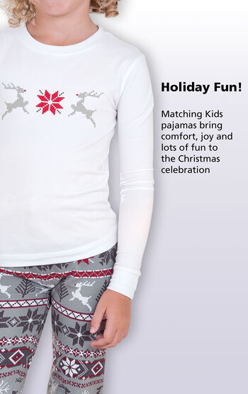 Close-up of Long-sleeve top with the following copy: Holiday fun! Matching Kids pajamas bring comfort, joy and lots of fun to the Christmas celebration