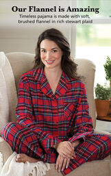 Model sitting on couch wearing Stewart Plaid Flannel Boyfriend Pajamas with the following copy: Our Flannel is Amazing. Timeless PJs are made with soft, brushed flannel in rich Stewart plaid image number 2