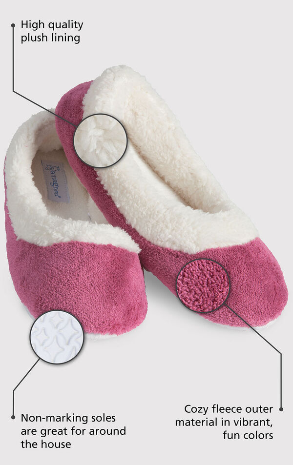 Close up of the Pink World's Softest Slipper with the following copy: High quality plush lining adds warmth and a touch of glamour. Non-marking soles are great for around the house. The softest pile fleece and an extra-padded footbed image number 1