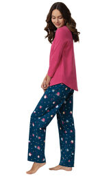 Model wearing Navy and Pink Present Print PJs, facing to the side image number 1
