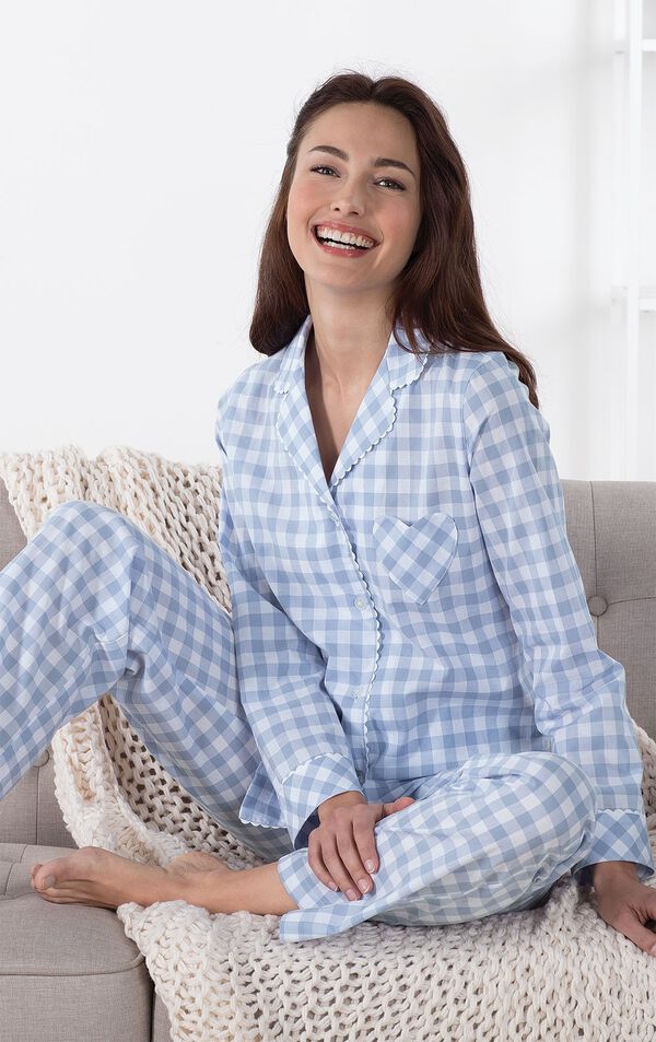 Model sitting on couch with blanket wearing Periwinkle Heart2Heart Gingham Boyfriend Pajamas image number 3