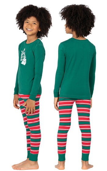 Model wearing Red and Green Christmas Stripe PJ for Kids, facing away from the camera and then to the side
