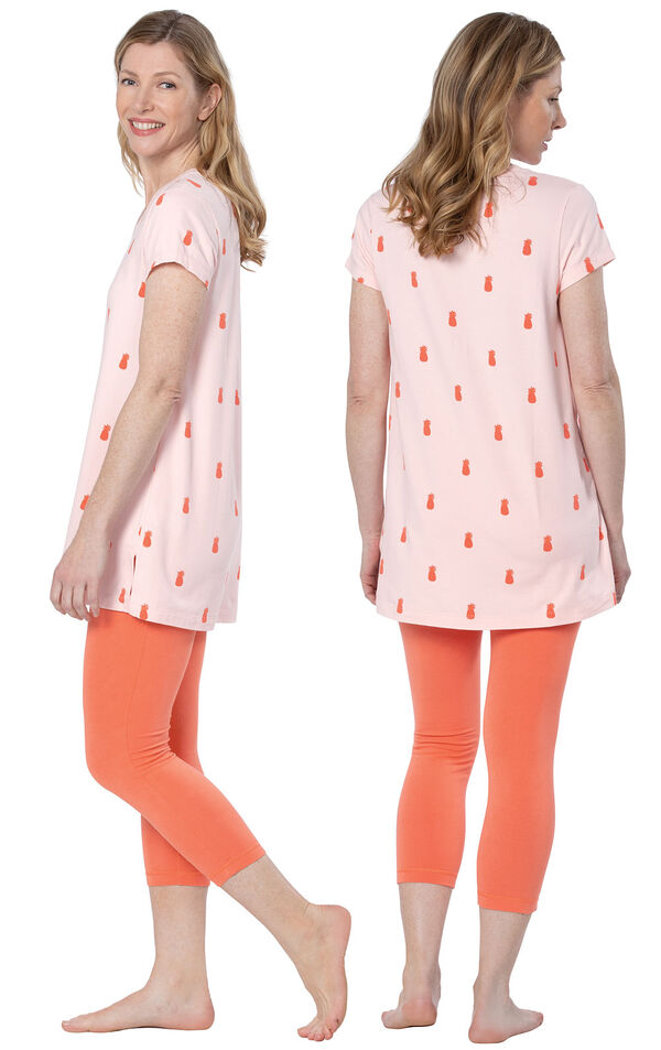 Model wearing Short Sleeve and Legging Pajamas - Coral, facing away from the camera and then to the side image number 1