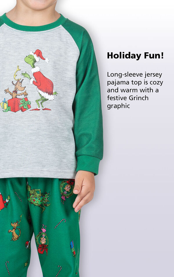 Close-up of Dr. Seuss' The Grinch PJ Long-Sleeve Top with the following copy: Holiday fun! Long-sleeve jersey pajama top is cozy and warm with a festive Grinch graphic. image number 3