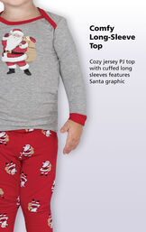 Close-up of St. Nick PJs Comfy Long-Sleeve Top with the following copy: Cozy jersey PJ top with cuffed long sleeves features Santa Graphic image number 2