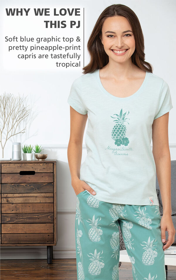 WHY WE LOVE THIS PJ: Soft blue graphic top and pretty pineapple-print capris are tastefully tropical image number 2