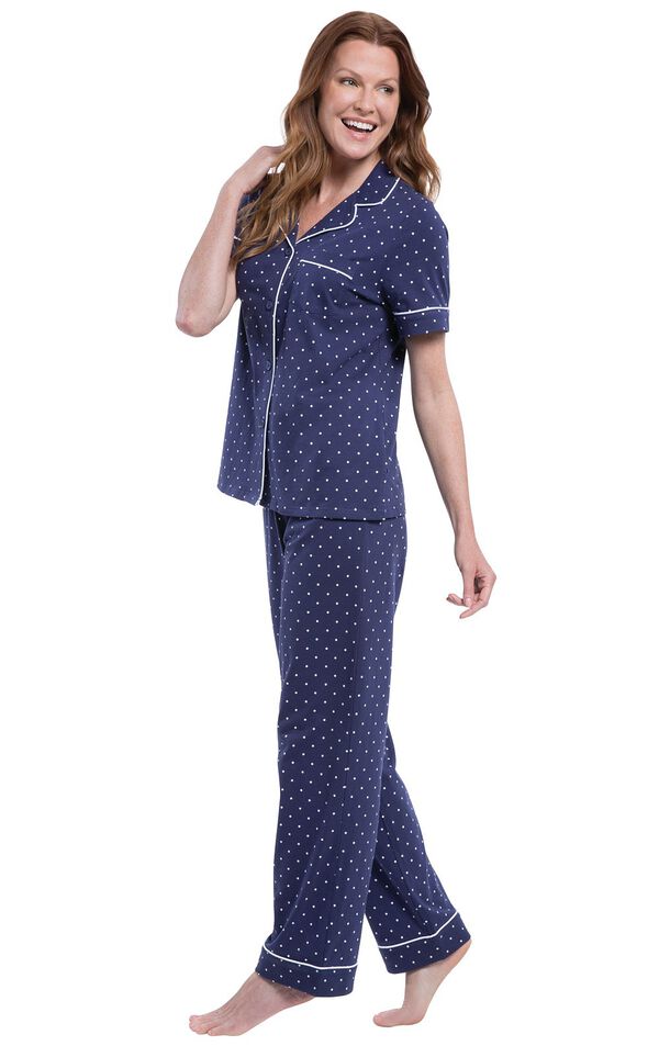 Model wearing Navy Blue and White Polka Dot Short Sleeve Button-Front PJ for Women, facing to the side