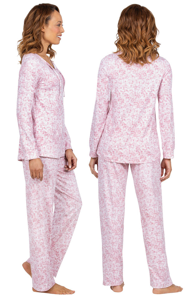 Model wearing Pink Print Tie-Neck PJ for Women, facing away from the camera and then to the side image number 1