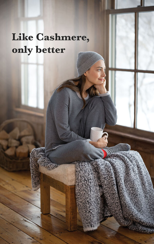 Model wearing Charcoal World's Softest Jogger PJs by a couch with the following copy: Like Cashmere, only better". image number 4
