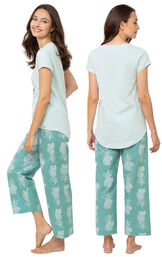 Model wearing Margaritaville Breezy Bedtime Pajamas - Turquoise, facing away from the camera and then facing to the side image number 1