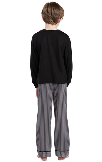 Model wearing Charcoal Gray and Black Stripe PJ for Youth, facing away from the camera