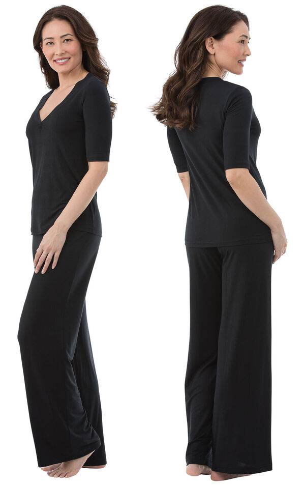 Model wearing Black Stretch Knit PJ for Women, facing away from the camera and then facing to the side