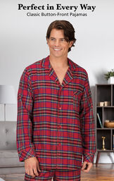 Model wearing Stewart Plaid Flannel Button-Front Men's Pajamas by couch with the following copy: Perfect in Every Way, Classic Button-Front Pajamas image number 2