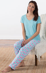 Model sitting on chair wearing Aqua Floral V-neck Short-Sleeve PJ for Women with Modern Floral Full-length pants image number 3