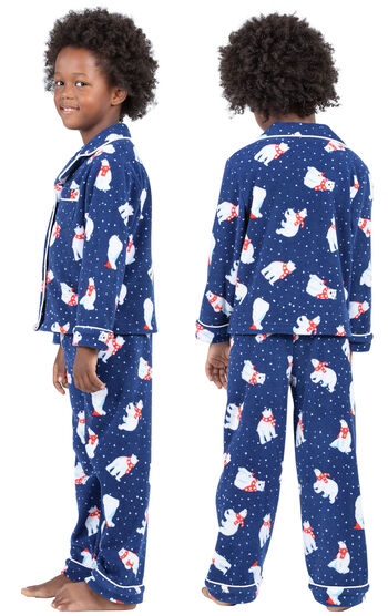 Model wearing Navy Polar Bear Fleece Button-Front PJ for Kids, facing away from the camera and then facing to the side