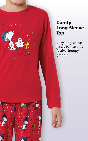 Close-up of comfy red long-sleeve top with the following copy: Cozy long sleeve jersey PJ features festive Snoopy graphic.