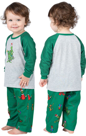 Infant wearing green and gray Dr. Seuss' The Grinch™ Pajamas, facing away from the camera and then facing to the side