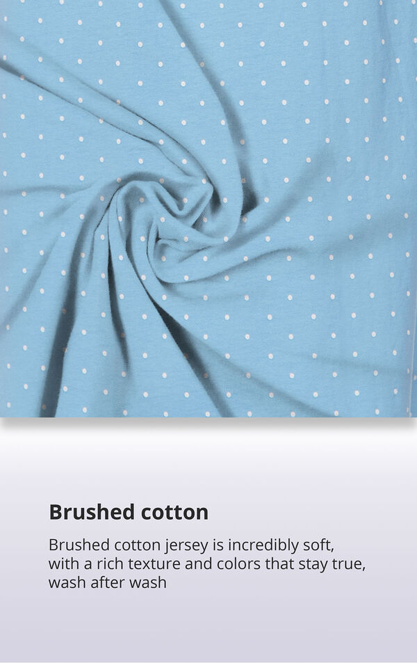 Blue Polka Dot Fabric Swatch with the following copy: Brushed cotton jersey is soft, inside and out. Machine washable cotton jersey won't fade or thin out. High-quality fabric means colors stay bright. Comfy mid-weight fabric is breathable. image number 5