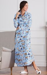 Model leaning on couch wearing Light Blue Dog Tired Print Gown for Women and Puppy slippers image number 3