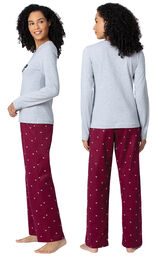 Model wearing Deep Red Hearts PJ for Women, facing away from the camera and then to the side image number 1