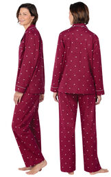 Model wearing Deep Red Hearts Flannel Button-Front PJ for Women, facing away from the camera and then to the side image number 1