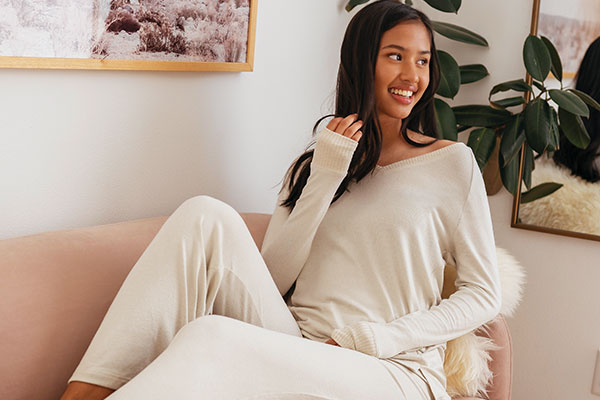 A model wearing Pajamagram Eversoft Fleece pajamas