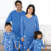 A family wearing PajamaGram Matching Family Pajamas
