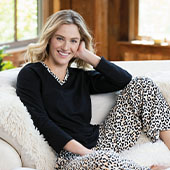 A model wearing PajamaGram Leopard Print Pajamas in Black