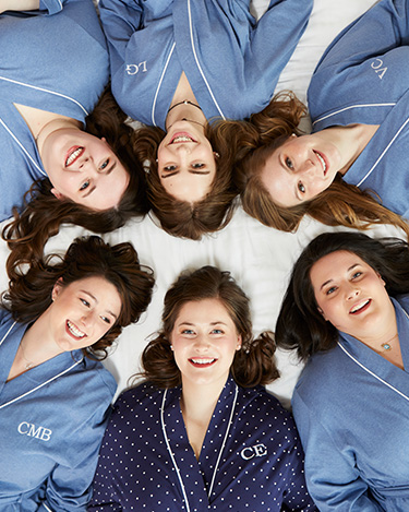 A group of bridesmaids wearing PajamaGram personalized robes