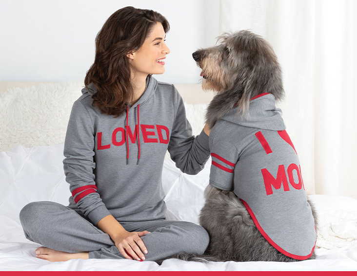 A model and her dog wearing PajamaGram I Love Mom & Loved Matching Pet & Owner PJs